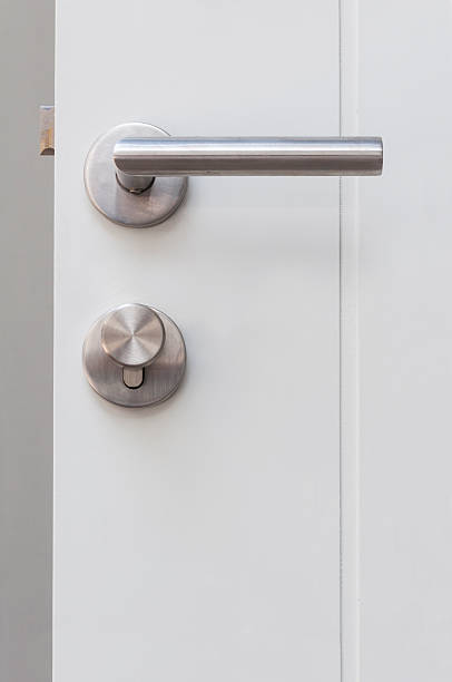 istock door knob on the white door 484762763