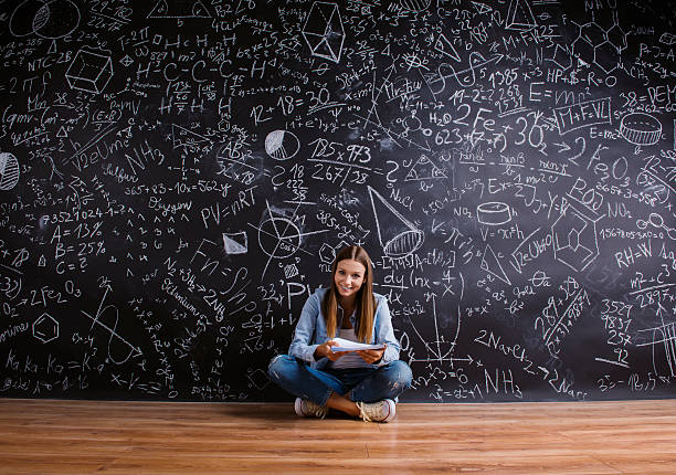 istock Beautiful young girl in front of blackboard 484762992