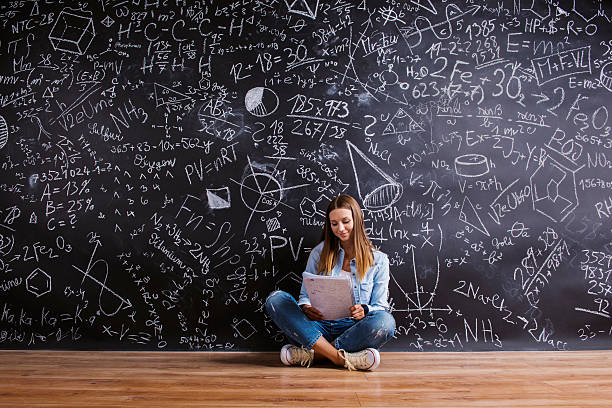 istock Beautiful young girl in front of blackboard 484762996