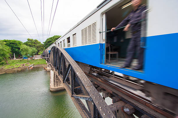 поезд на мосту на реку квай - kwai river kanchanaburi province bridge thailand стоковые фото и изображения