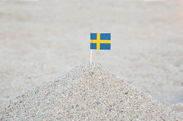 A broken Swedish flag blowing in the wind