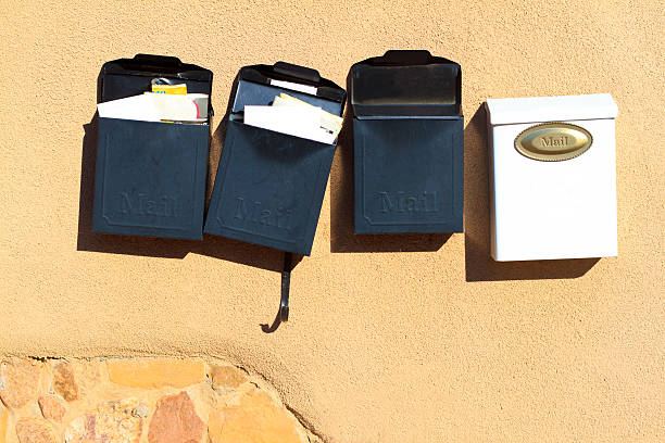 Line of Black and White Mailboxes with Letters