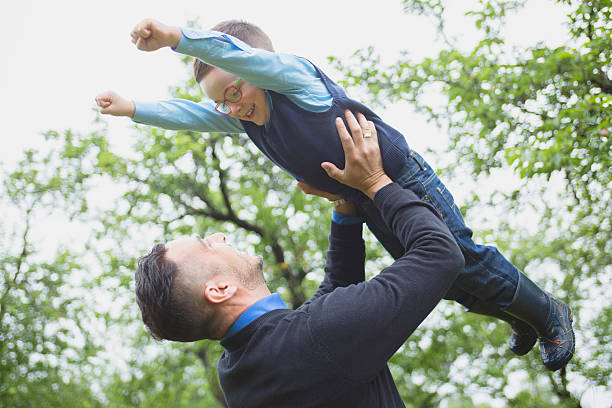 istock Father and son in forest on a meadow 484774110