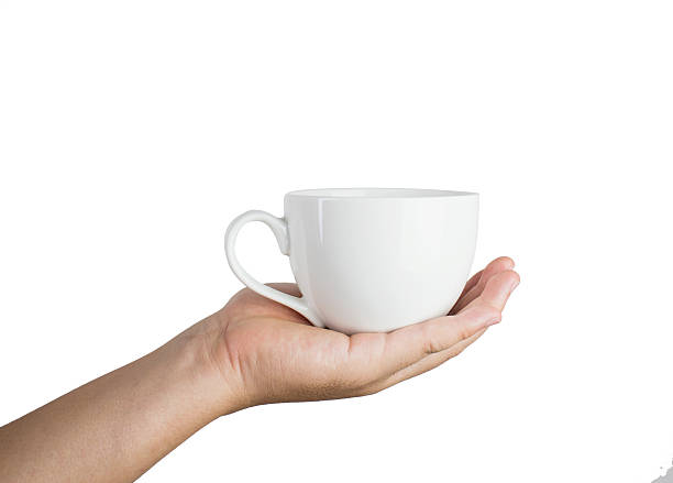 istock hand holding white mug isolated on white background 484774292