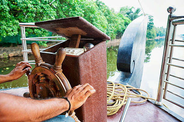 istock Driving a boat down the Kerala Backwaters in India 484775012