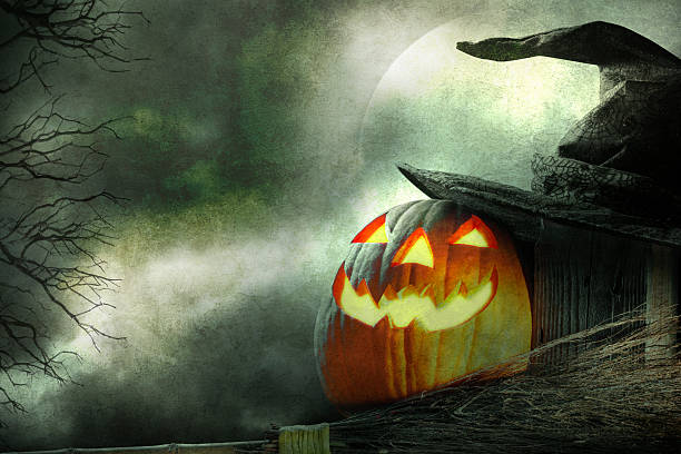 istock Jack O' Lantern On Fence With Witches Hat and Broom 484775554