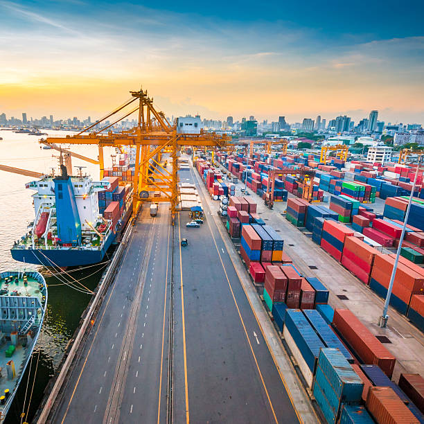 istock Cargo ship in the harbor at sunset . 484778674