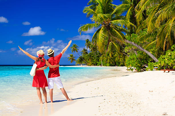 istock happy loving couple on summer beach 484779162