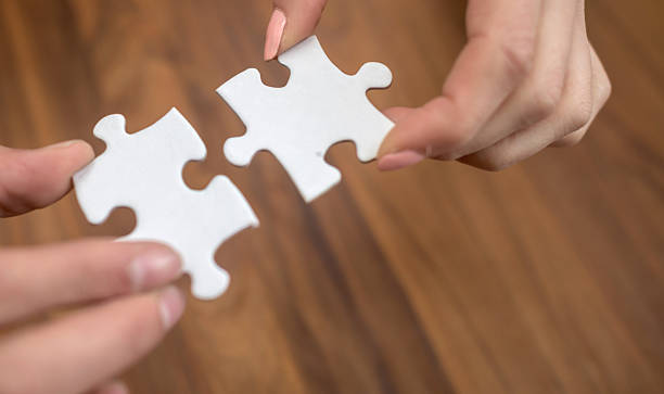 istock Putting pieces of a puzzle together 484779546