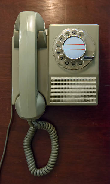 istock Vintage telephone on wooden table 484789344