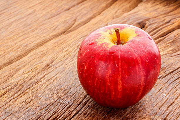 istock Apple on old wooden floor 484790758