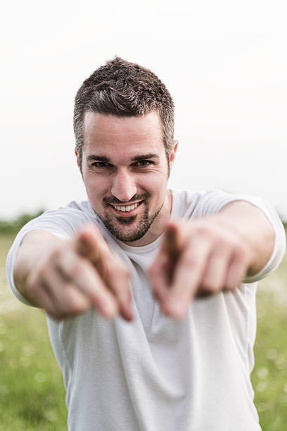istock Happy young man in a field 484790928