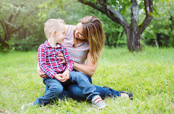 istock Mother and son in forest having fun 484791168