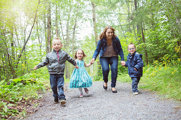 istock family in forest having fun together 484791226