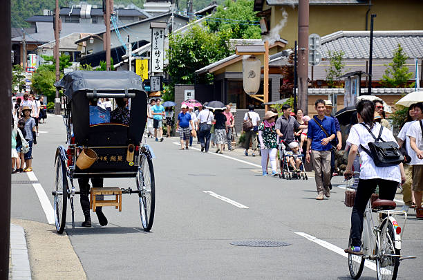 Kyoto, Japan - July 12, 2015: Traveler use rickshaw for tour around arashiyama city in Kyoto, Japan