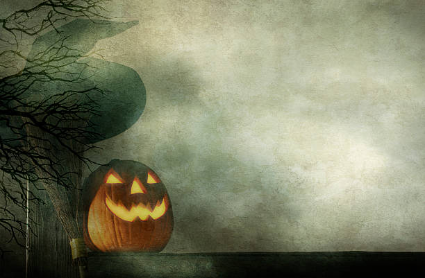 istock Jack O' Lantern On Fence With Witches Hat and Broom 484794904