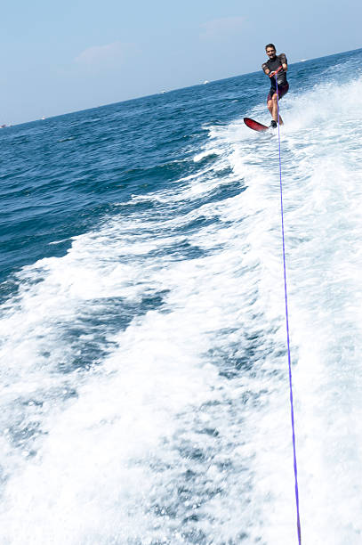 istock Young man is skiing on water 484795102