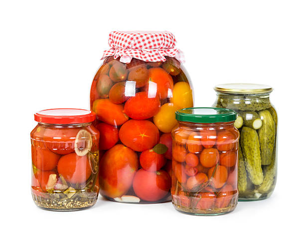 istock Pickled tomatoes and cucumbers  isolated on white 484796290