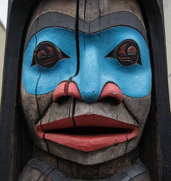 Totem pole Close-up of a face on a totem pole in the city of Duncan, British Columbia, known as the "city of totems" for its dozens of totem poles along city streets in the downtown area duncan british columbia stock pictures, royalty-free photos & images
