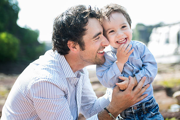 Father and son smiled together in nature