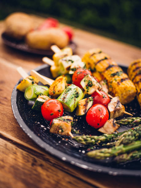 istock Barbecue grilled vegetable kebabs, corn and asparagus on a plate 484804636