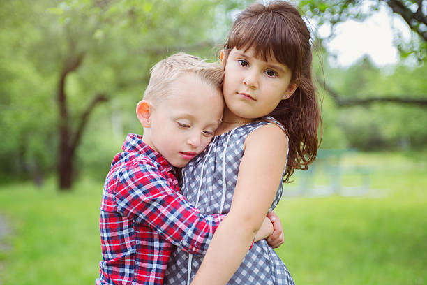 istock image of two happy children having fun in the park 484806870