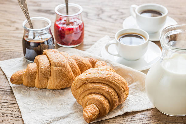 istock Croissants with cups of coffee 484808464