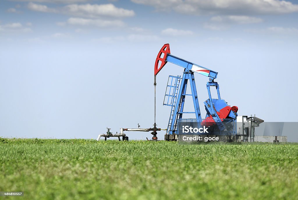 oil pump jack on oilfield Agricultural Field Stock Photo