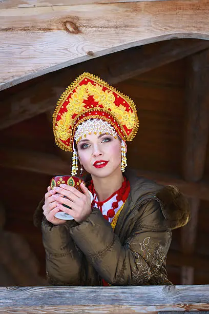 Russian girl drinking tea in the village