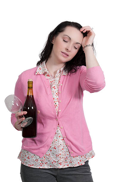 Woman with Wine Beautiful woman holding a bottle of wine psycological stock pictures, royalty-free photos & images