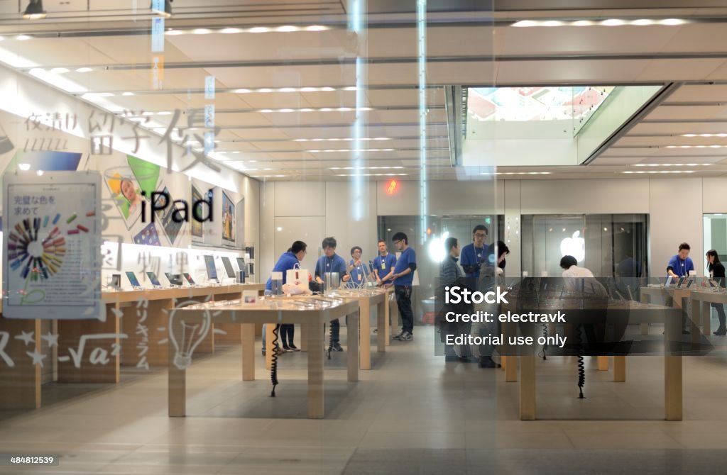 iShop Tokyo, Japan - April 8, 2014: People shopping at an Apple store in the upscale shopping area of Ginza. Apple Store Stock Photo