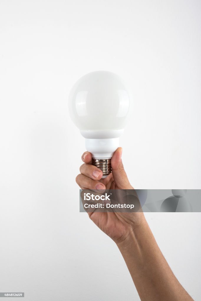 Hand Holding a Lightbulb Advice Stock Photo
