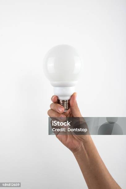 Hand Holding A Lightbulb Stock Photo - Download Image Now - Advice, Business, Choice