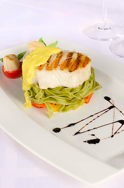 istock fish fillet cut with noodles 484815311