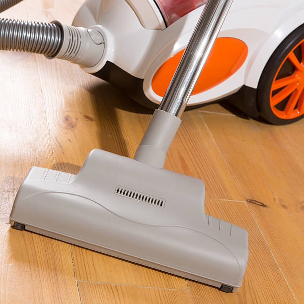 istock vacuum cleaner stands in the home 484815997