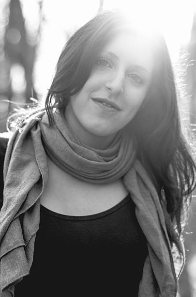 istock black and white girl sun flare portrait 484818558