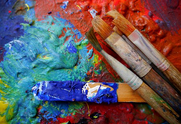 Bright colorful abstract background from oil paint with artist tools