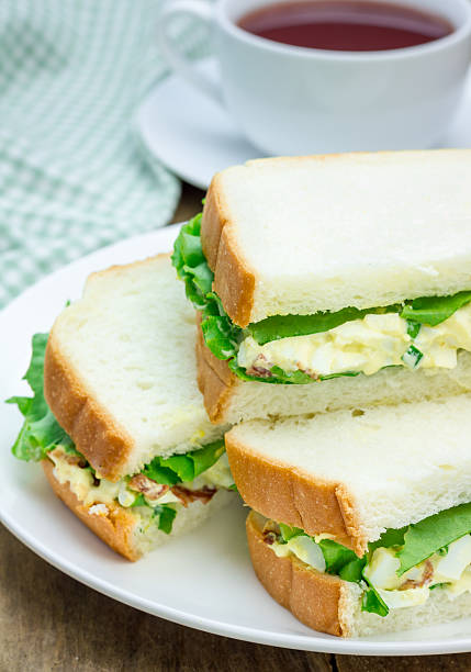 istock Sandwich with egg salad, bacon, green onion and lettuce 484823060