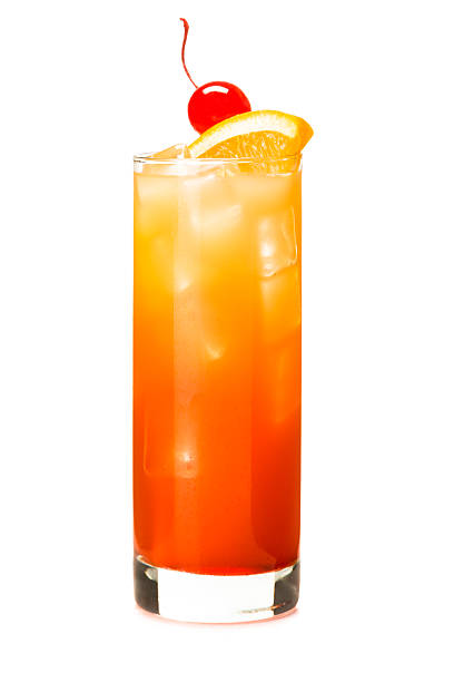 Tequila Sunrise Alcoholic Cocktail drink on White Tequila Sunrise Alcoholic Cocktail drink isolated on White background with orange wedge and cherry garnish in tall glass tequila sunrise stock pictures, royalty-free photos & images