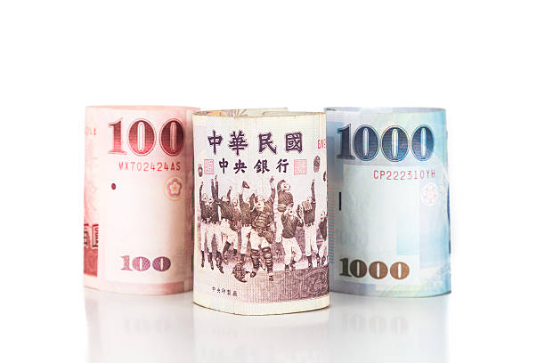 istock Close up of rolled up New Taiwan Dollar currency note 484825638