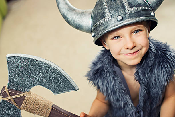 istock Happy little boy dressed up as barbarian warrior 484825806
