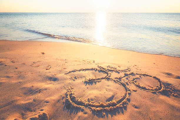istock Om symbol in the sand by the ocean 484828644