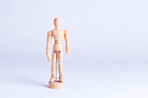 istock wooden mannekin on white background 484829392