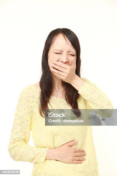 Young Japanese Woman Feels Like Vomiting Stock Photo - Download Image Now - 2015, Adult, Adults Only