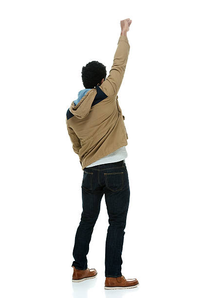 istock Rear view of casual man cheering 484830372