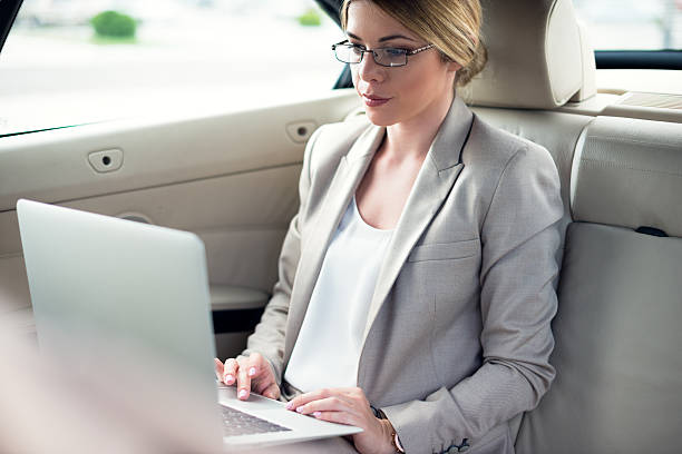 istock Working on laptop in the car 484830884