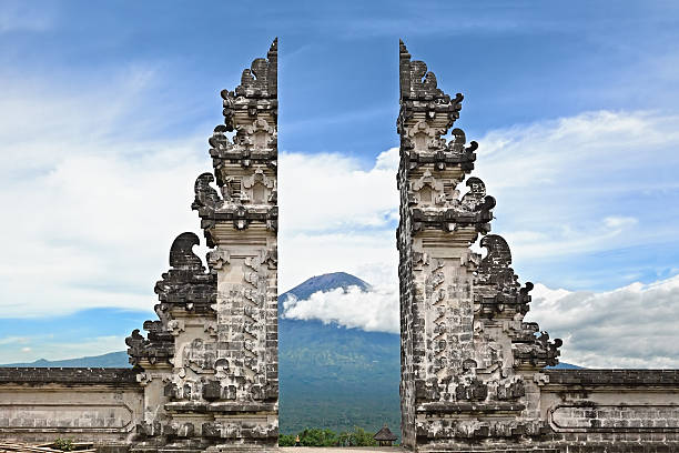 Symbol Bali - hindu temple on Agung mount background Entrance gate Pintu Bintar to traditional temple Lempuyang on Agung mount background - Bali island symbol. Culture and architecture of Asian people, Indonesian and Balinese landscapes and wallpapers balinese culture stock pictures, royalty-free photos & images