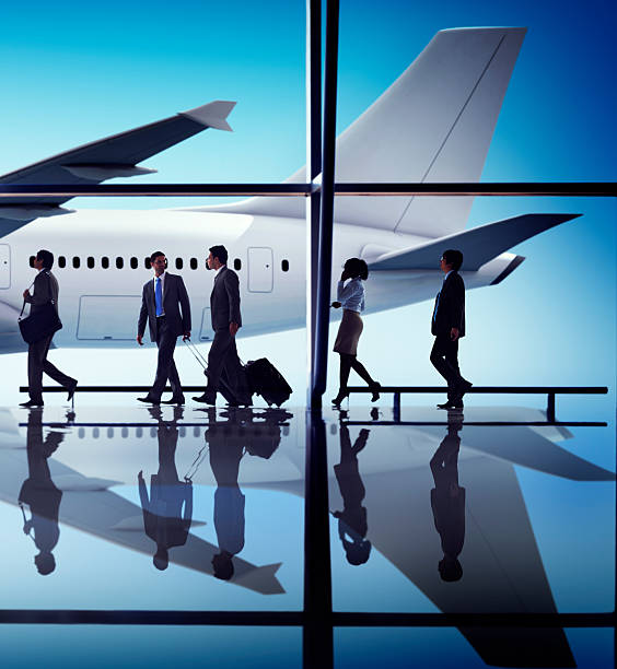istock Multiethnic Group of Business People with Airplane 484831390