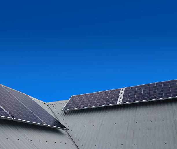 istock Solar power sun panels on slanted rooftop 484835100