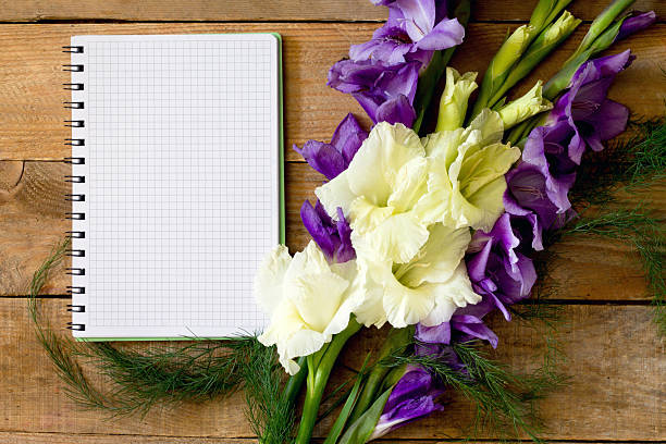 istock Flowers blue and white gladiolus with a notebook 484835436